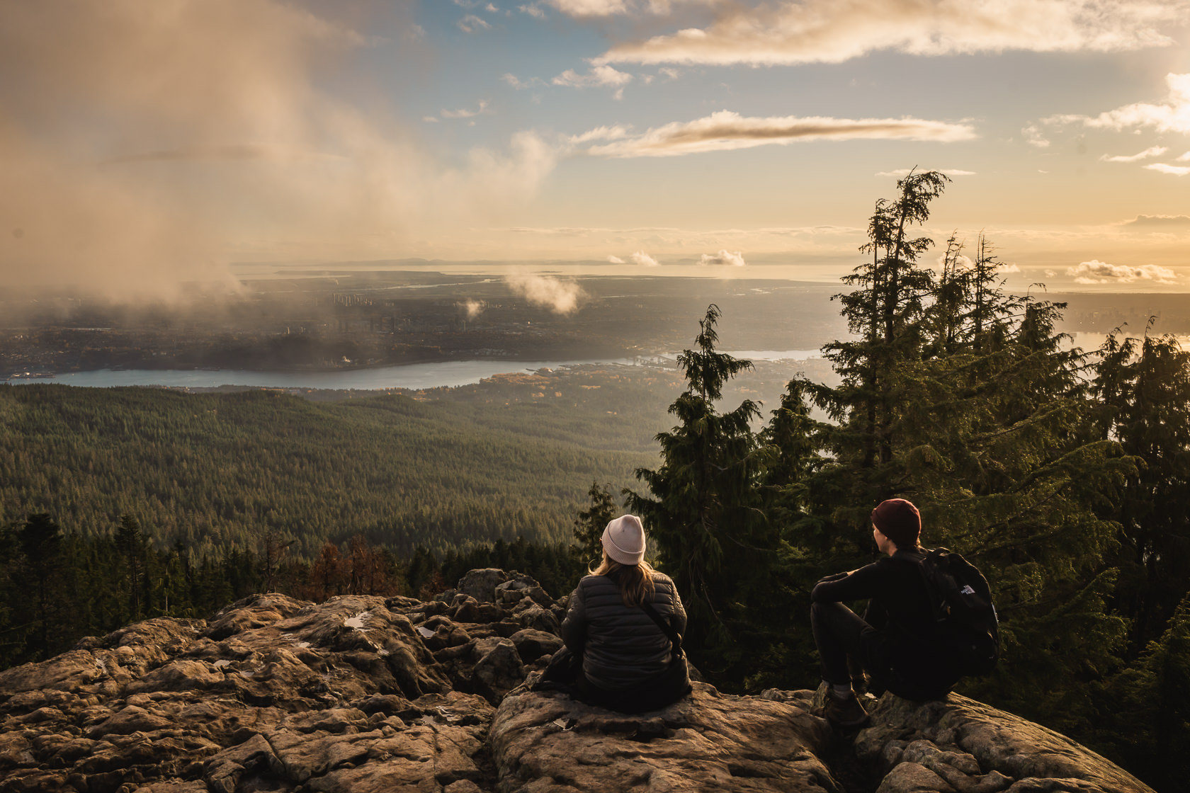 hikers admiring sunset views from the summit of Dog Mountain in North Vancouver