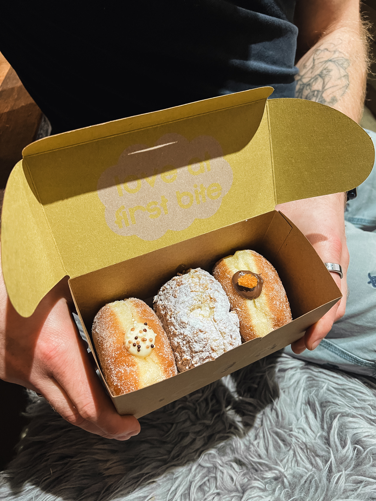 three Mello doughnuts in a box