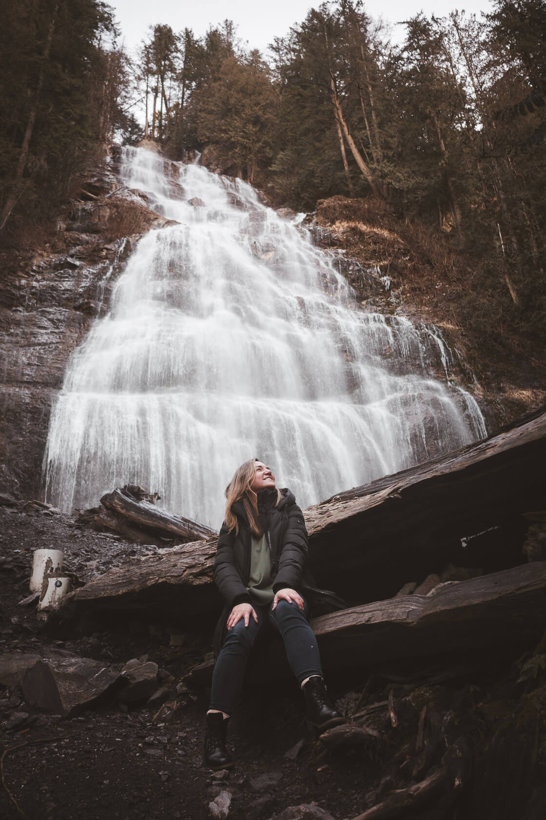 hiker posing in front of Bridal veil Falls waterfall