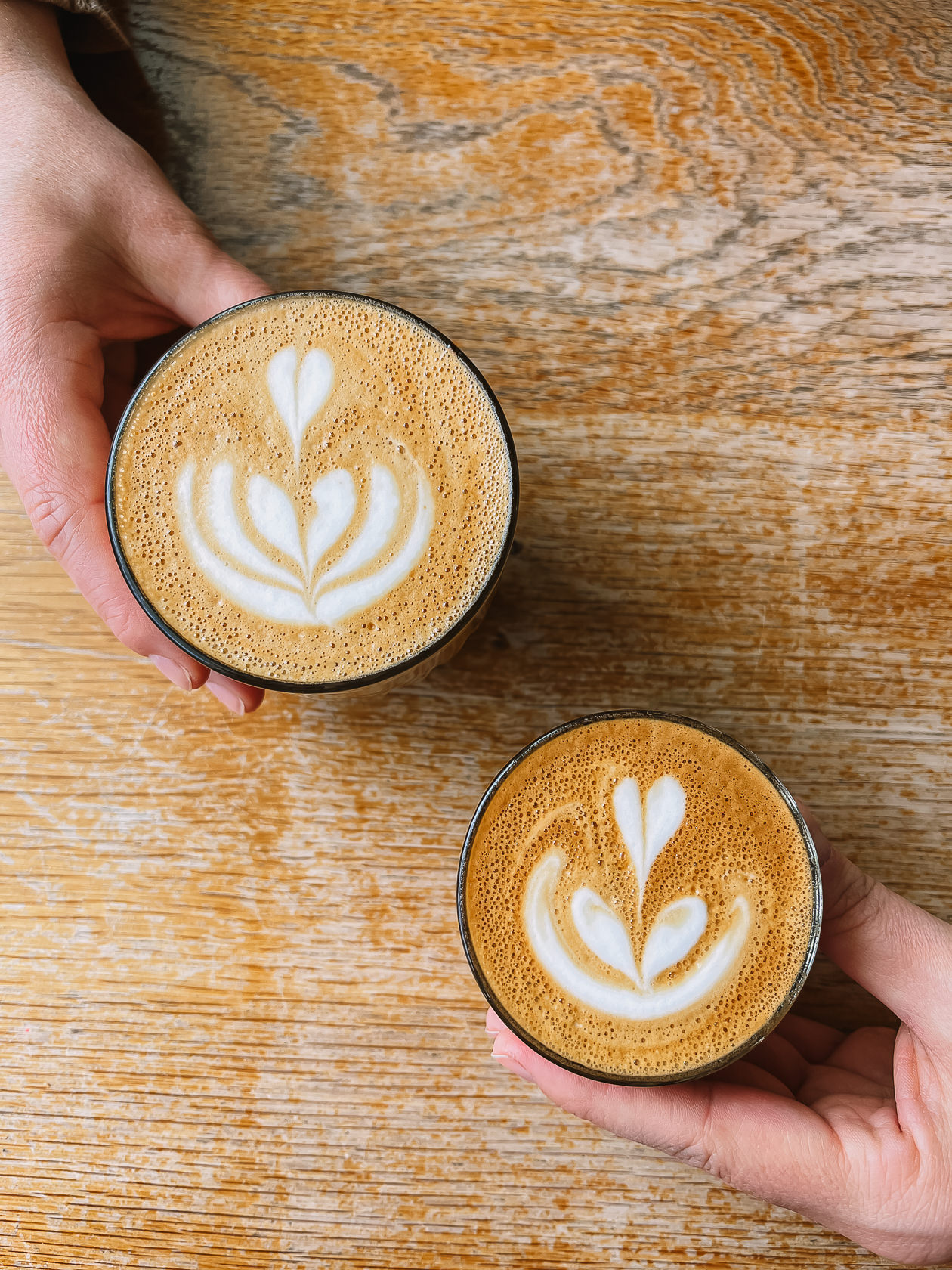 Latte and cappuccino on the table in Nemesis coffee shop in Vancouver