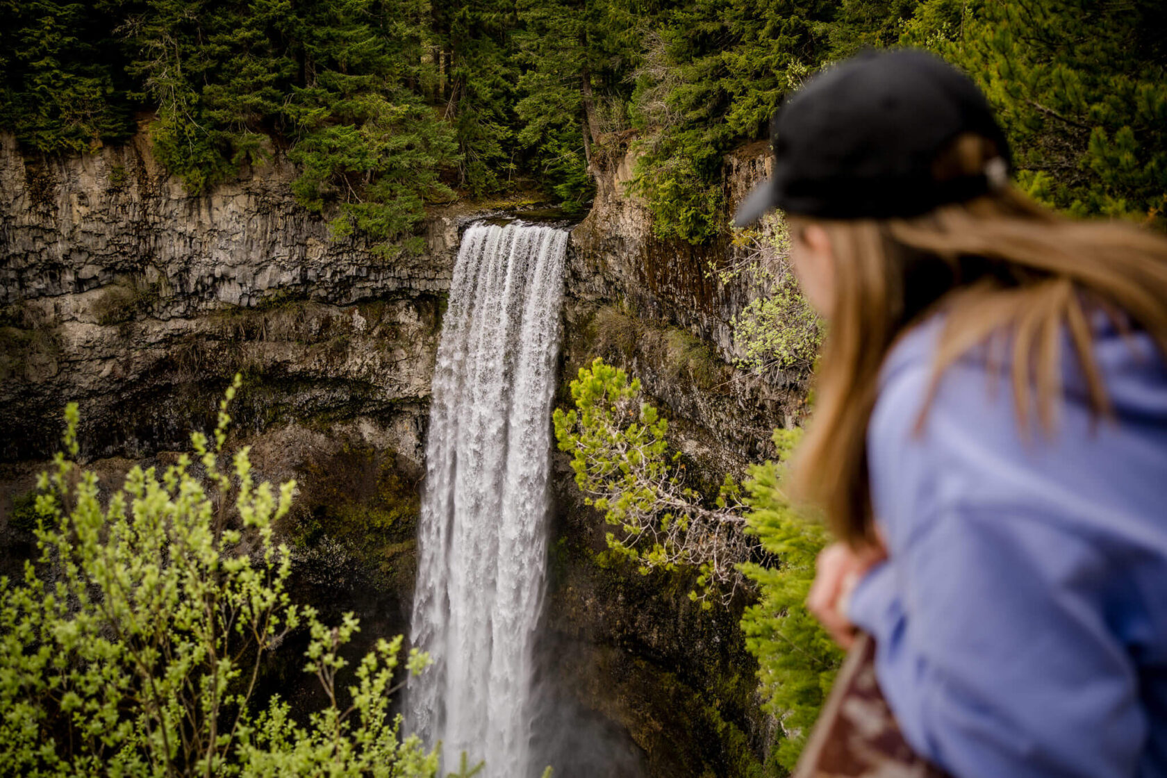 Female hiker looking towards Brandywine falls waterfall from the viewing platform