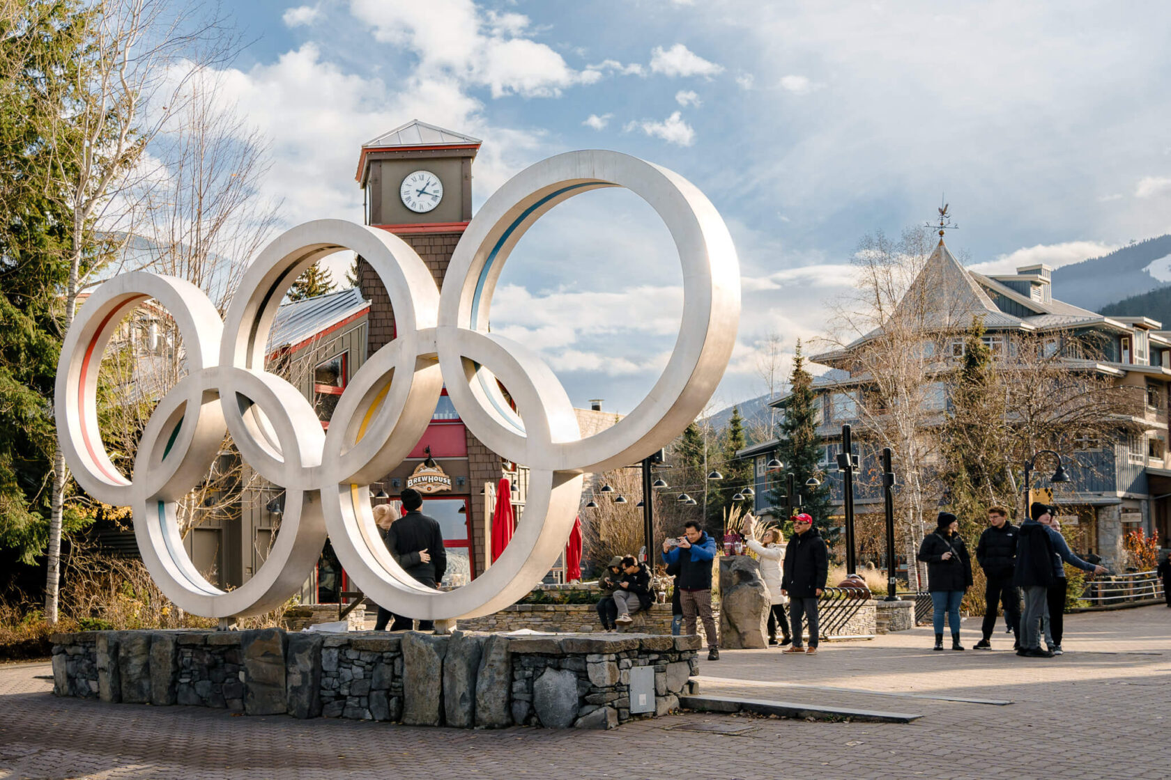 People taking photos of Olympic rings in Whistler village in Canada