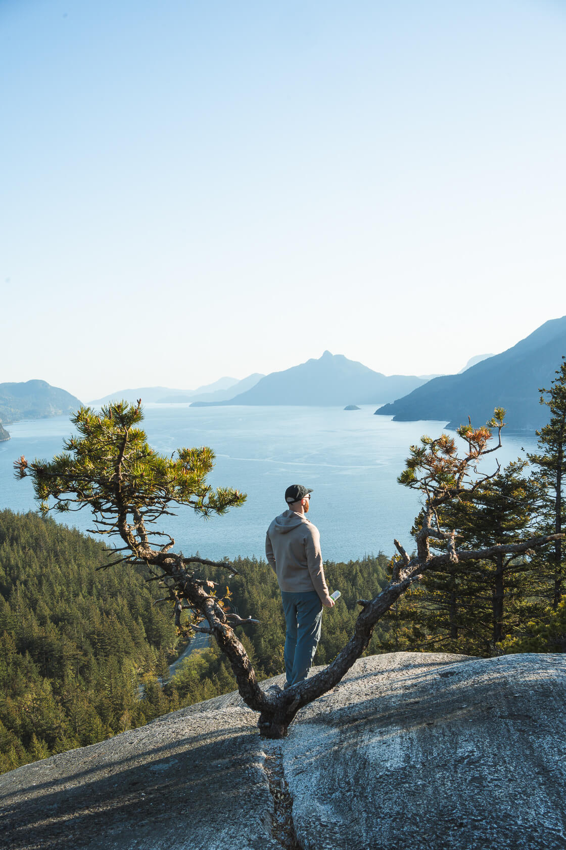 man standing on Quercus Lookout looking at Howe Sound