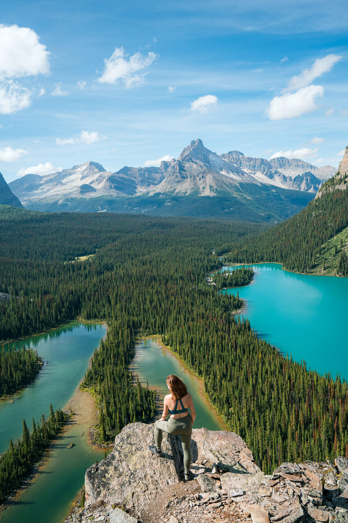 Female hiker on top of Opabin Plateau looking down towards Lake O'Hara