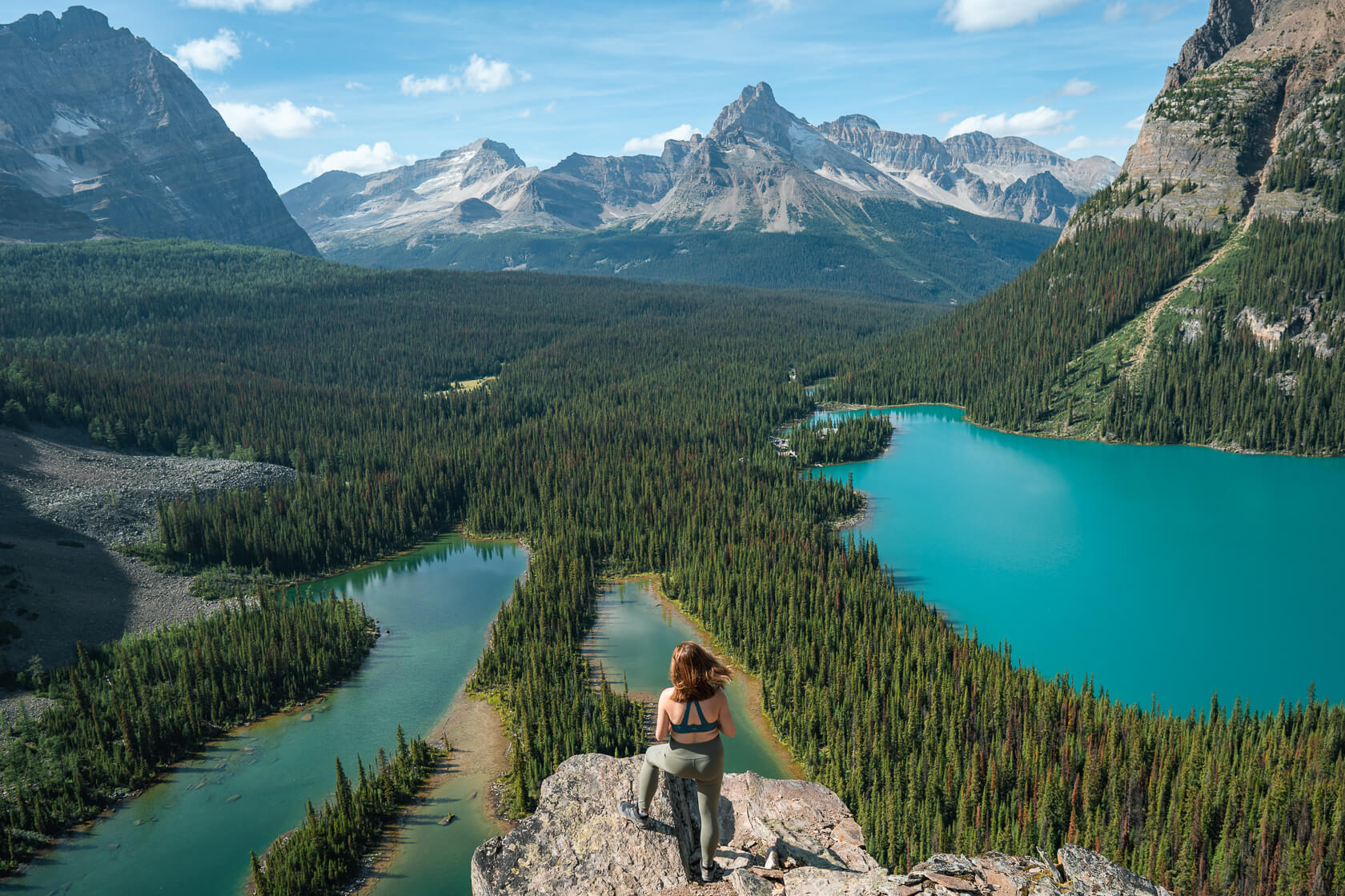 Female hiker looking down at Lake O'Hara from Opabin Plateau